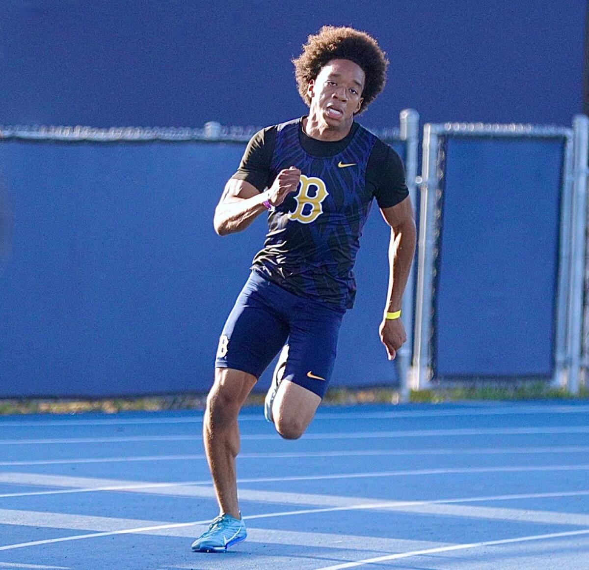 Antrell Harris of Birmingham High runs the corner during a 200-meter race.