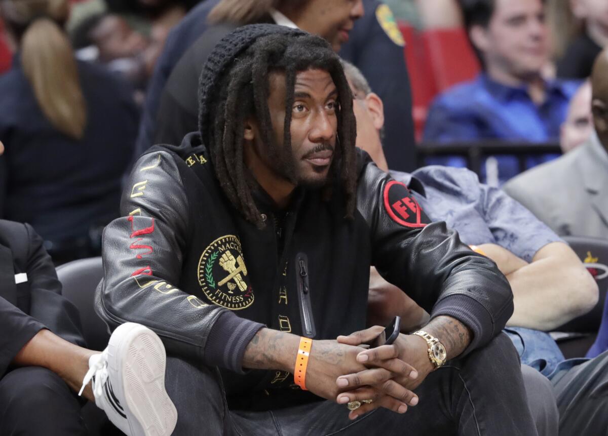 FILE - Former NBA basketball player Amar'e Stoudemire watches during the second half of an NBA basketball game between the Miami Heat and Sacramento Kings, Monday, Jan. 20, 2020, in Miami. Stoudemire is facing a misdemeanor battery charge after police say he punched his teenage daughter in the face. Court records show the former Phoenix Suns and New York Knicks star was arrested early Sunday, Dec. 18, 2022, and later released on $1,500 bond. (AP Photo/Lynne Sladky, File)