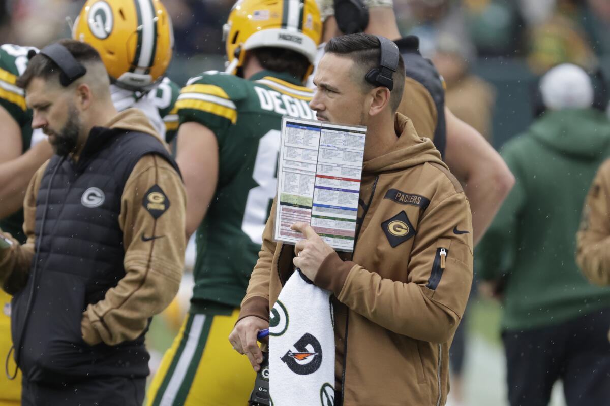 Green Bay Packers coach Matt LaFleur stands on the sideline during the first half.