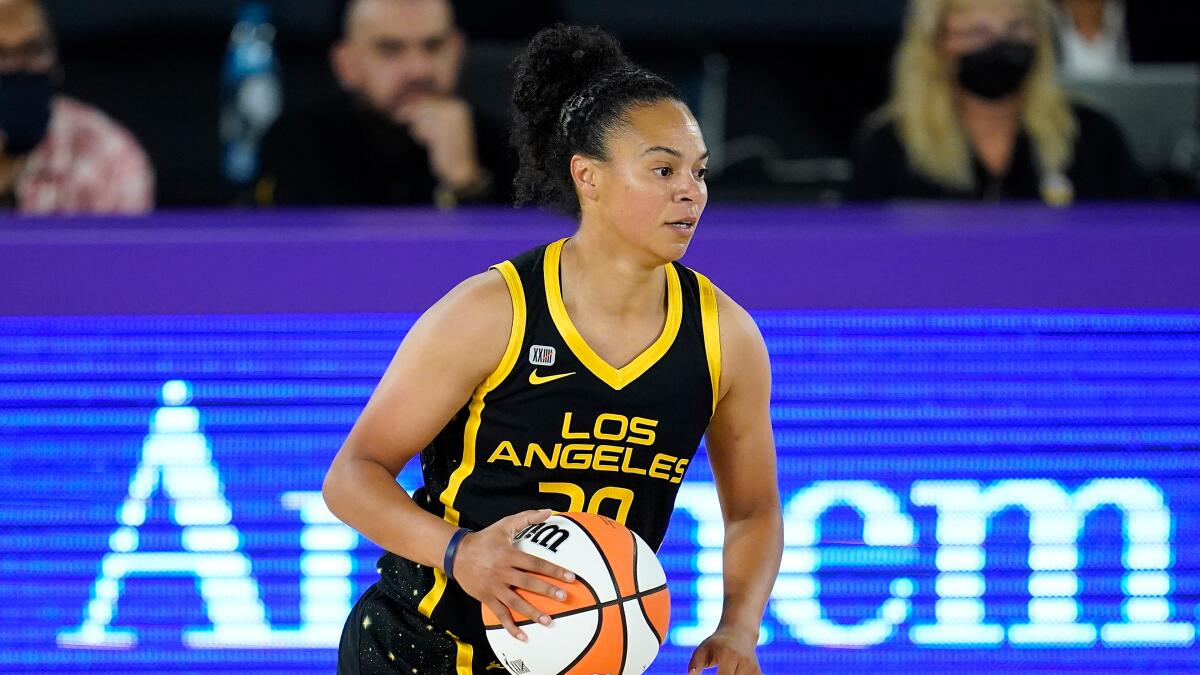 Sparks guard Kristi Toliver handles the ball during a game in May 2021.