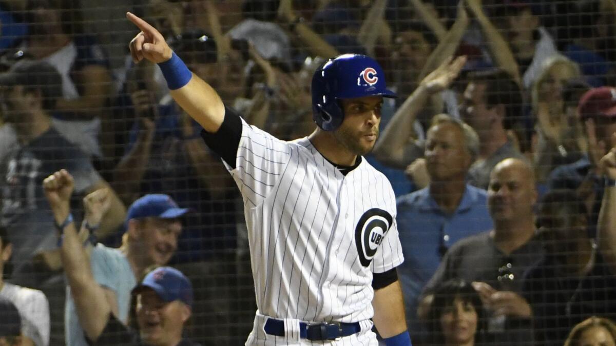 Tommy La Stella reacts after scoring against the San Francisco Giants.