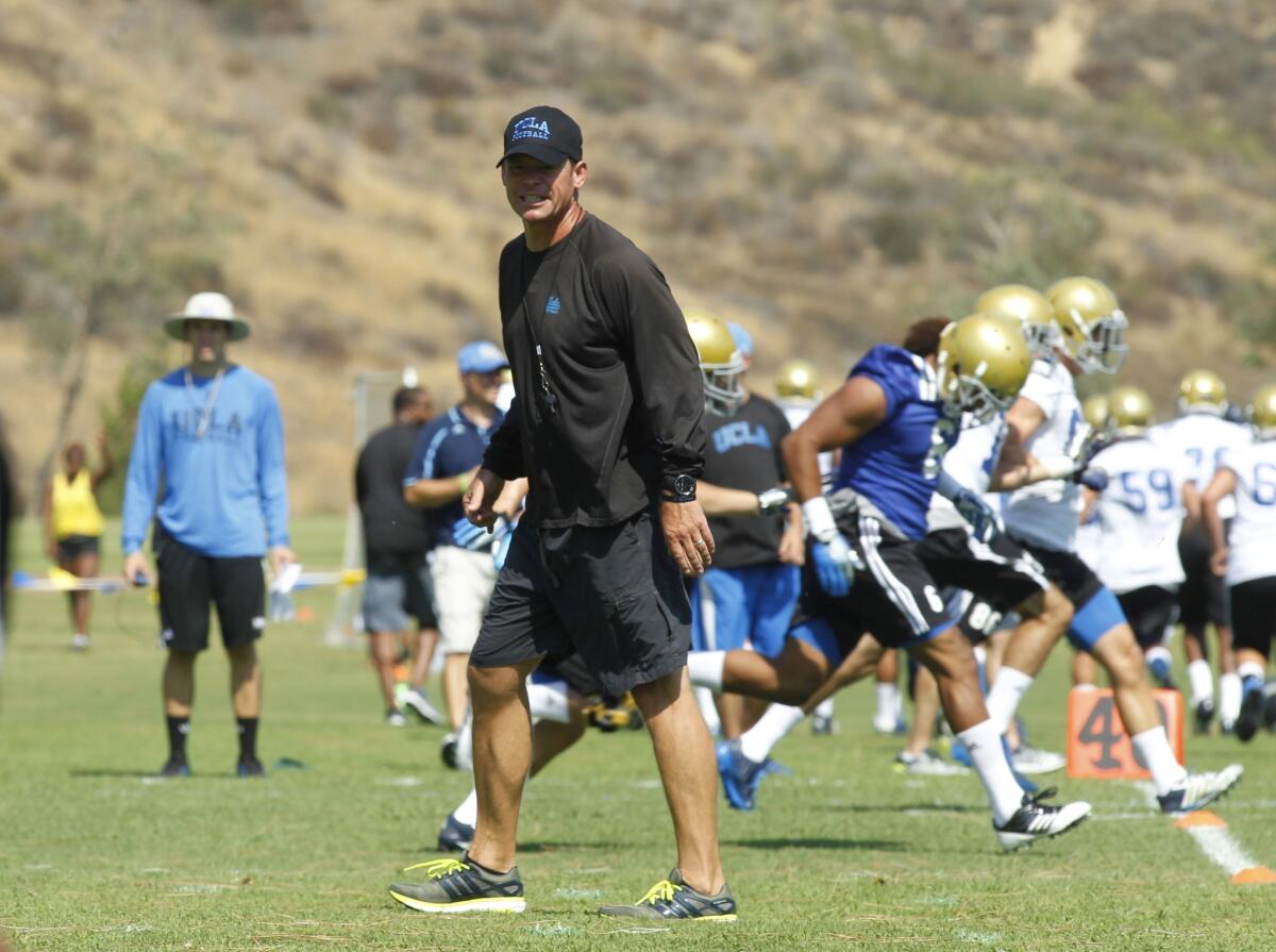 UCLA Coach Jim Mora has several of his Bruin football players wearing GPS tracking devices to measure and record their performance.