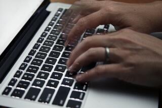  photo shows a person working on a laptop 