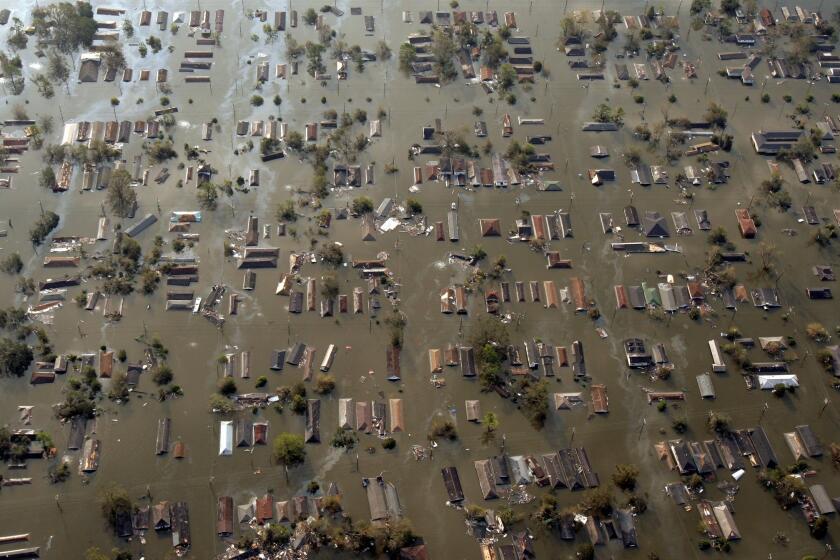 Water surrounds homes just east of downtown New Orleans in an aerial view of damage from Hurricane Katrina on Aug. 30, 2005.