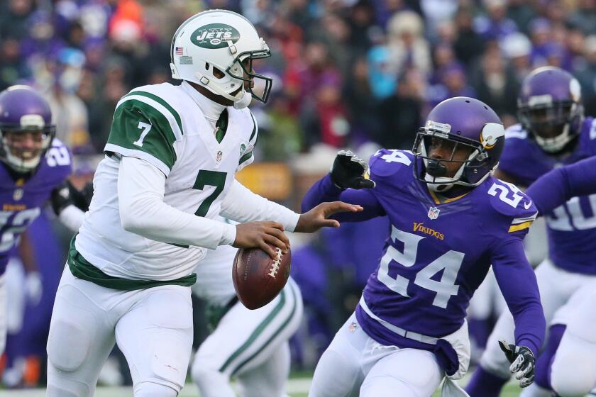 New York Jets quarterback Geno Smith is pressured by Minnesota's Captain Munnerlyn on Dec. 7.