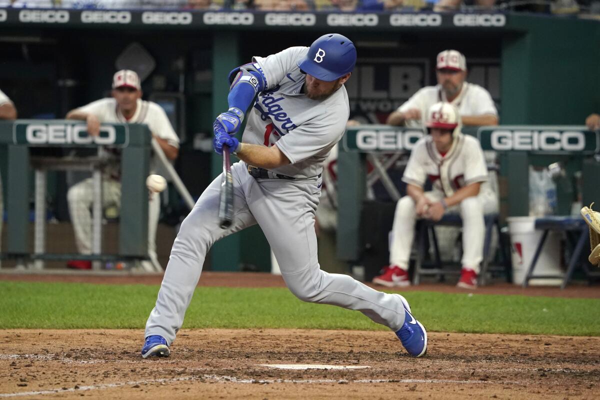 The Dodgers' Max Muncy hits an RBI double against the Kansas City Royals on Aug. 13, 2022.