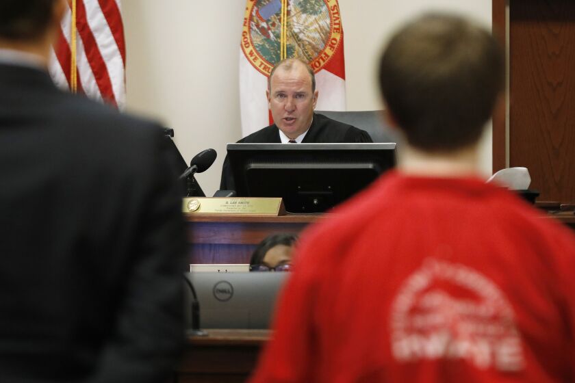 Aiden Fucci stands before Judge R. Lee Smith during his sentencing hearing, Friday, March 24, 2023. in St. Augustine, Fla. Smith sentenced the 16-year-old Florida boy to life in prison on Friday for fatally stabbing a 13-year-old classmate on Mother's Day in 2021. Fucci, who pleaded guilty just before his trial was set to start in February, was not eligible for the death penalty. (Bob Self/The Florida Times-Union via AP)