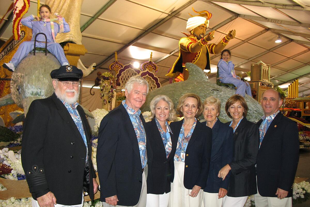 Anne Wortmann, third from left, Ann Hall, Nancy Skinner, Robin Sanders stand with others by Newport Beach's 2006 float.