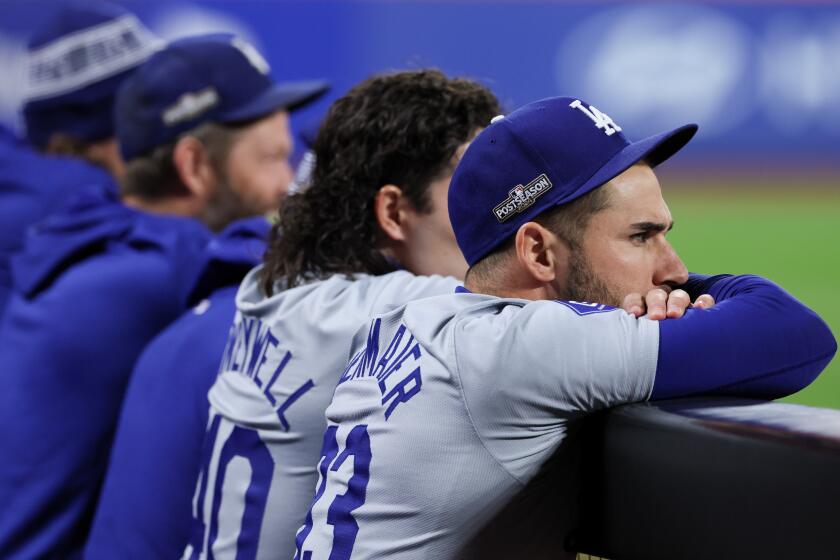 NEW YORK, NEW YORK - OCTOBER 18: Kevin Kiermaier #93 of the Los Angeles Dodgers watches from the dugout during the eighth inning in game five of the National League Championship Series against the New York Mets at Citi Field on Friday, Oct. 18, 2024 in New York. (Robert Gauthier / Los Angeles Times)