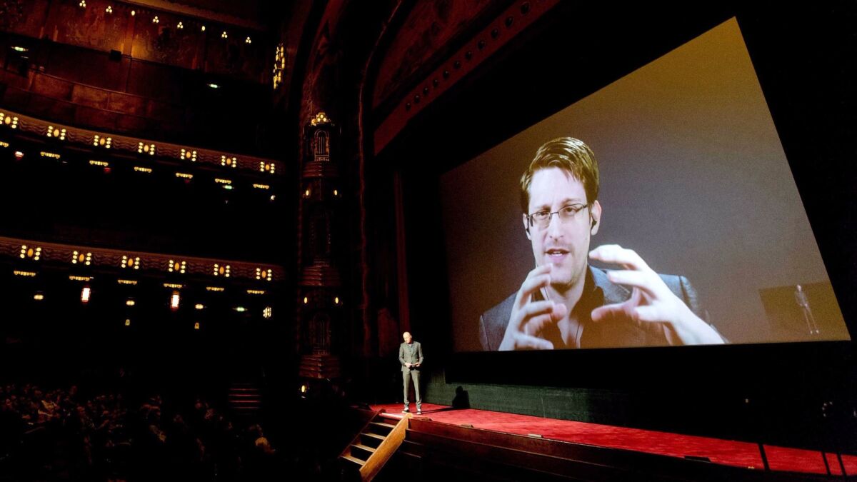 Edward Snowden spoke remotely at a screening of the film "Snowden" to an audience in Amsterdam.