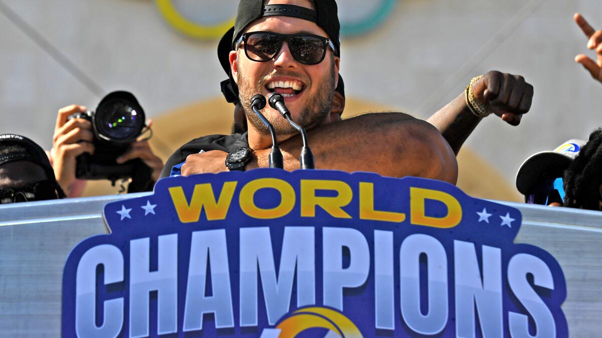 Los Angeles, United States. 14th Feb, 2022. Los Angeles Rams quarterback  Matthew Stafford (9) kisses his wife, Kelly, while celebrating after the  Rams won Super Bowl LVI at SoFi Stadium in Los