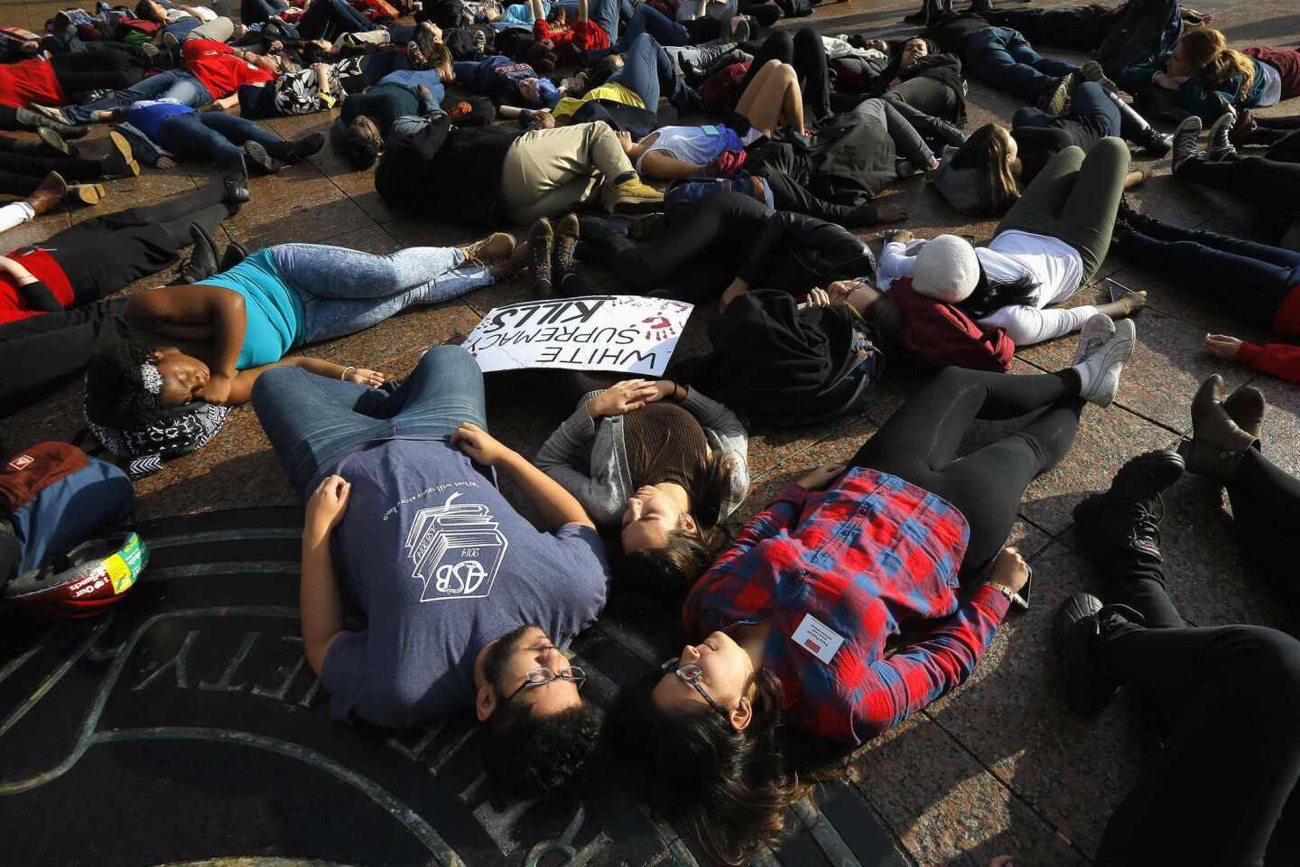 Demonstrators participate in a nationwide "Hands Up, Walk Out" protest Dec. 1 at Boston University.