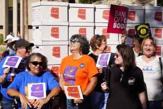 FILE - Arizona abortion-rights supporters gather for a news conference prior to delivering more than 800,000 petition signatures to the state Capitol to get abortion rights on the November general election ballot, July 3, 2024, in Phoenix. (AP Photo/Ross D. Franklin, File)