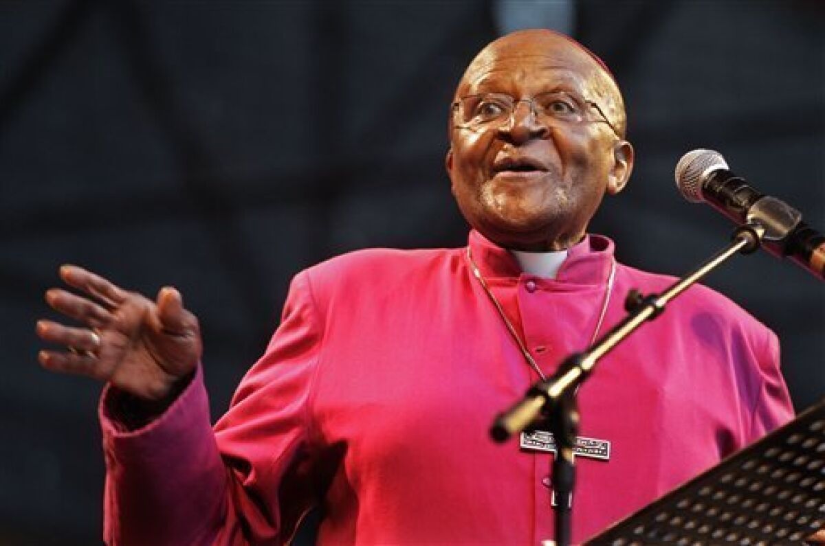 FILE - In this Sunday, Nov. 27, 2011 file photo South African Archbishop Desmond Tutu speaks during a climate justice rally held in Durban, South Africa, ahead of the official start or a two-week international climate conference. Three Nobel Peace Prize laureates, including Archbishop Desmond Tutu, have contested the awarding of this year’s prize to the European Union, saying the 27-nation bloc contradicts the values associated with the prize because it relies on military force to ensure security. In an open letter to the Nobel Foundation, Tutu of South Africa, Mairead Maguire of Northern Ireland and Adolfo Perez Esquivel from Argentina demanded that the prize money of 8 million kronor ($1.2 million) not be paid out this year. (AP Photo/Schalk van Zuydam, File)