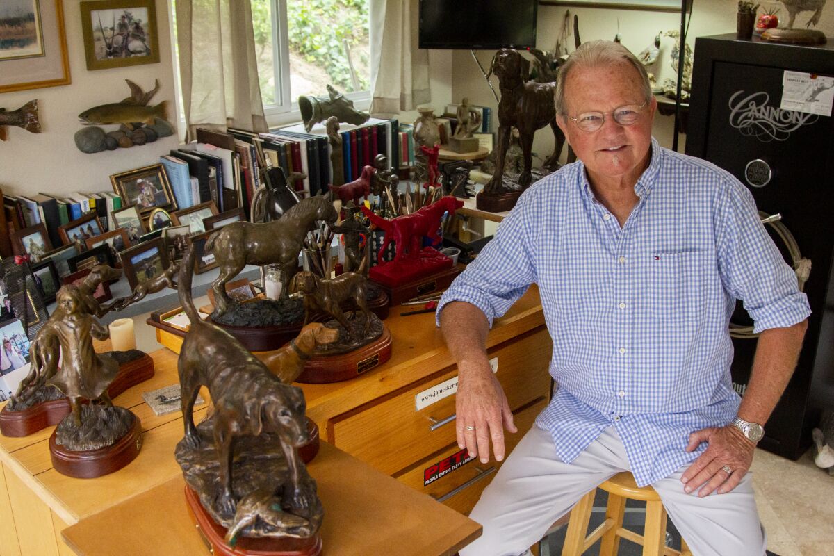James Kermott with some of his bronze sculptures, which include hunting dogs,