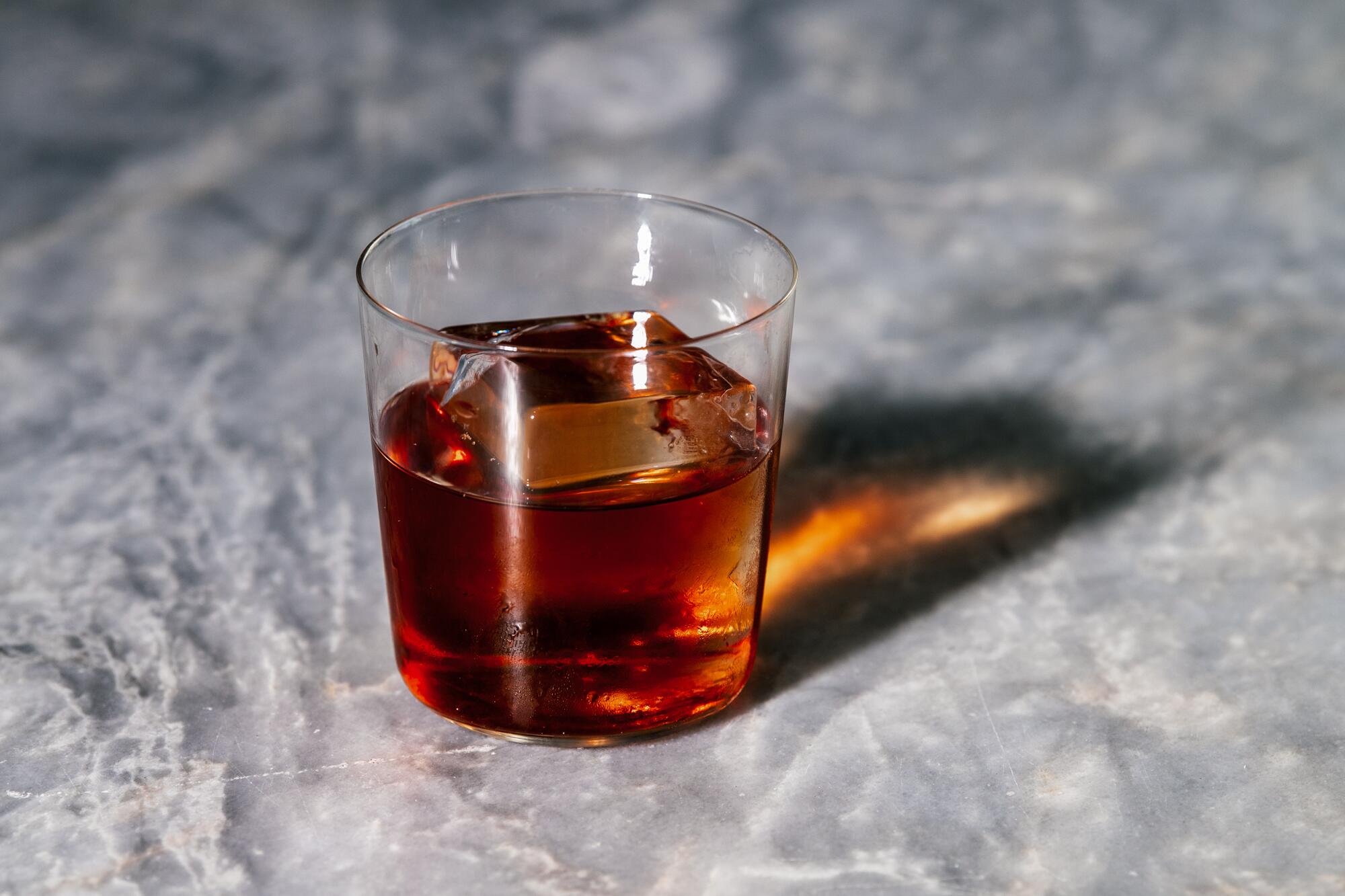 A Negroni cocktail on a bar.