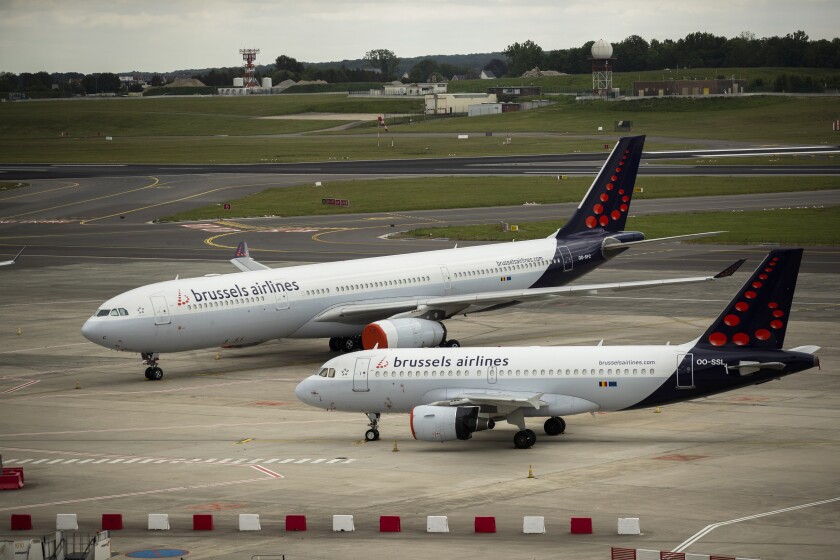 FILE - In this Tuesday, May 12, 2020 file photo, planes from Brussels Airlines on the tarmac at Brussels Airport in Brussels Tuesday, May 12, 2020. The European Union's airspace is filling up again with near-empty flights in pandemic times that even airlines admit serve no commercial purpose except securing valuable slots in some of the world's biggest airports. (AP Photo/Francisco Seco, File)