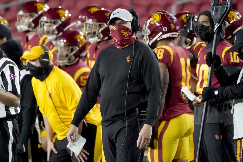 Southern California head coach Clay Helton looks up from the sideline during the second half of an NCAA college football game against Washington State in Los Angeles, Sunday, Dec. 6, 2020. (AP Photo/Alex Gallardo)