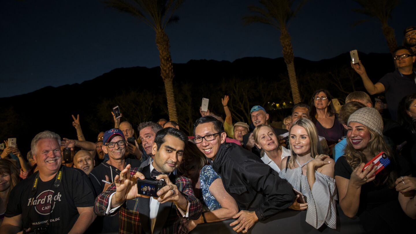 Actor and writer Kumail Nanjiani takes pictures with fans before hitting the red carpet of the 18th annual Palm Springs International Film Festival Gala.