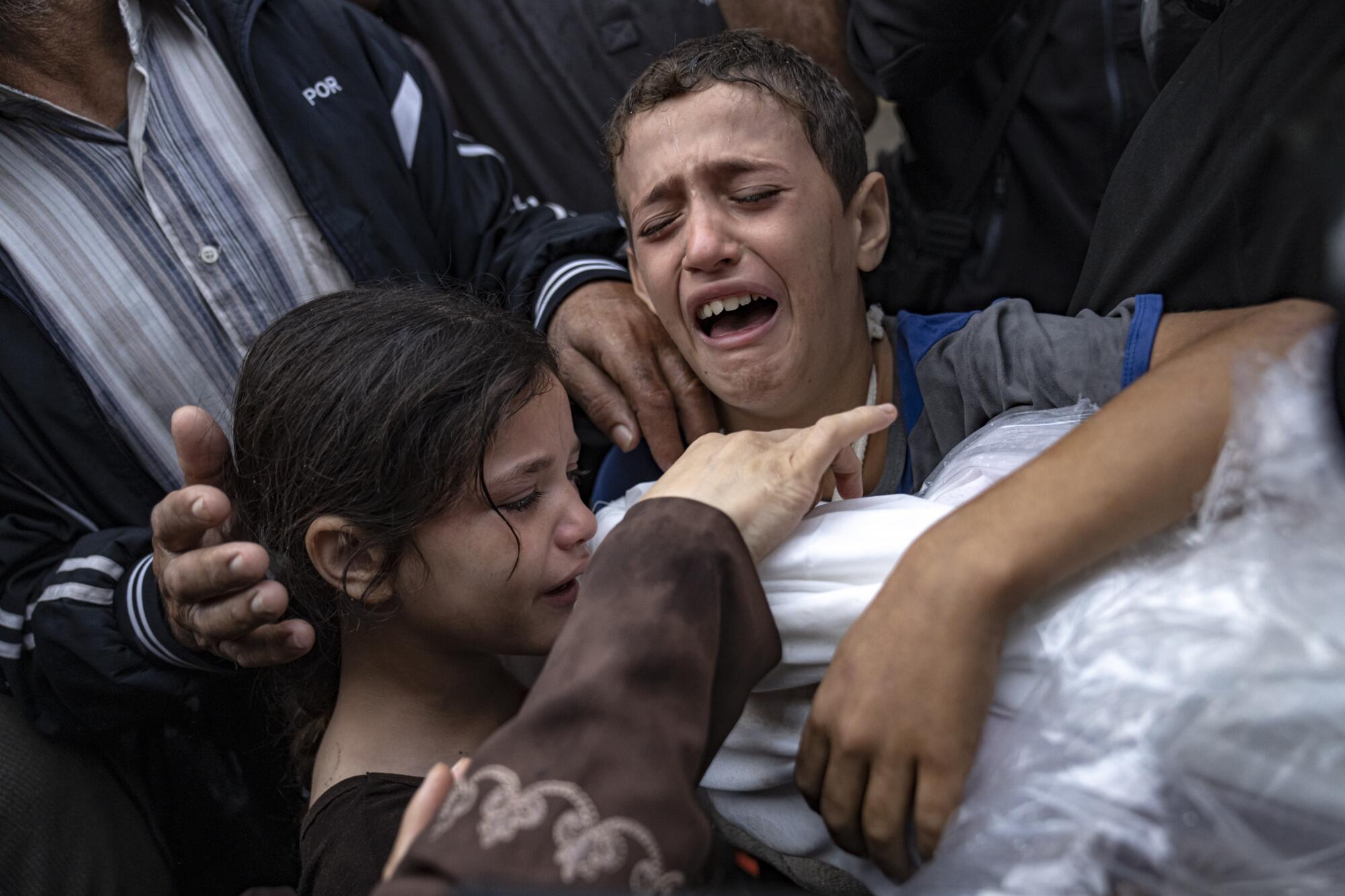 Children mourning relatives killed in Israeli bombardment of Gaza