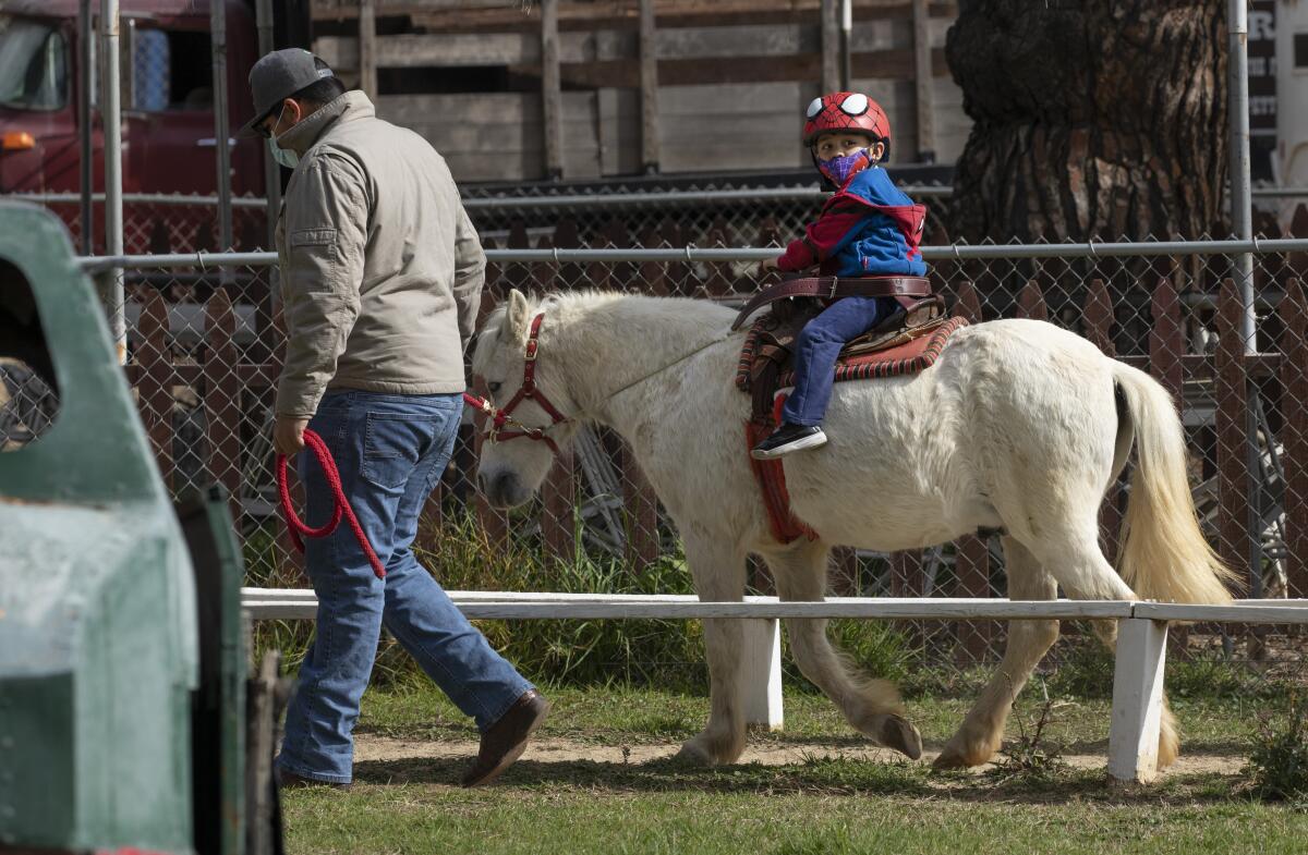 Mateo Jimenez rides a pony