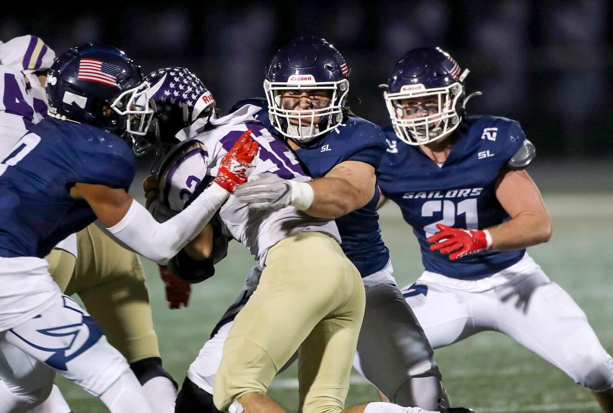 Newport Harbor defensive tackle Jacob Jurczyk stops Valencia during the CIF Southern Section Division 4 playoff game.