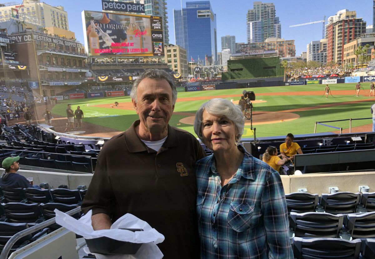Padres fans Dick Nasif and Maxine Barrows had two of the best seats in the house to watch Padres' 12-1 win over Braves..