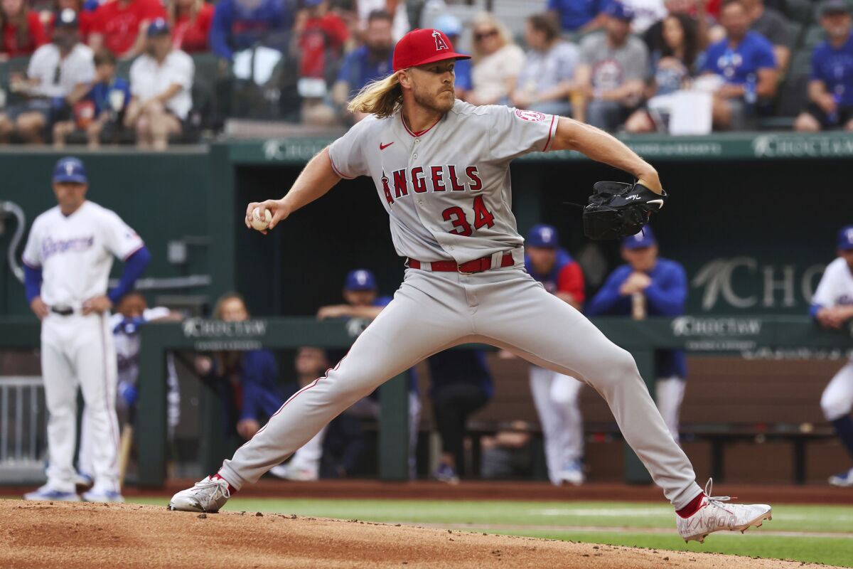 Angels' Noah Syndergaard pitches against the Texas Rangers on April 16, 2022, in Arlington, Texas.