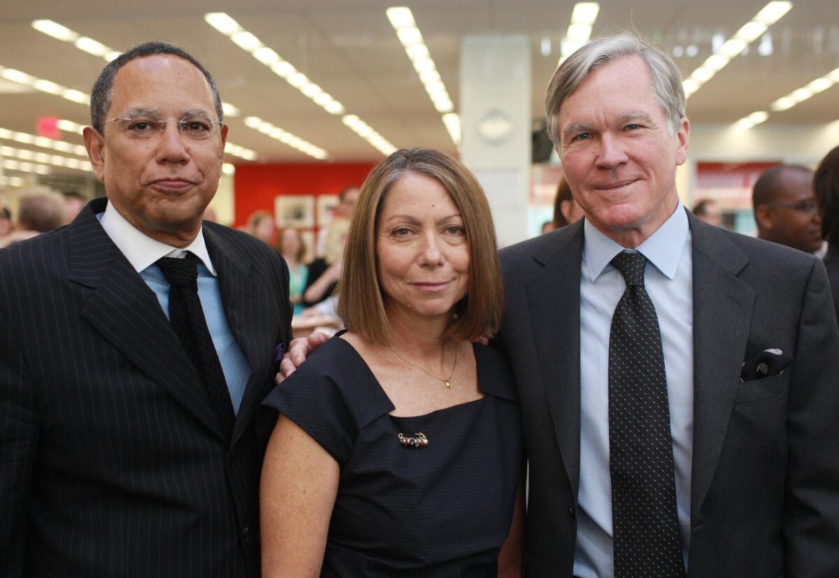 New York Times Executive Editor Jill Abramson was fired Wednesday after learning she earned less money than her predecessor, Bill Keller, right. She is succeeded by Dean Baquet, left, a former Los Angeles Times editor. This photo was taken on June 2, 2011, when Abramson was promoted to the top New York Times job.