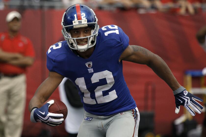 New York Giants wide receiver Steve Smith reacts after catching a second-quarter touchdown pass from quarterback Eli Manning against the Tampa Bay Buccaneers during an NFL football game Sunday, Sept. 27, 2009, in Tampa, Fla. (AP Photo/ Chris O'Meara)