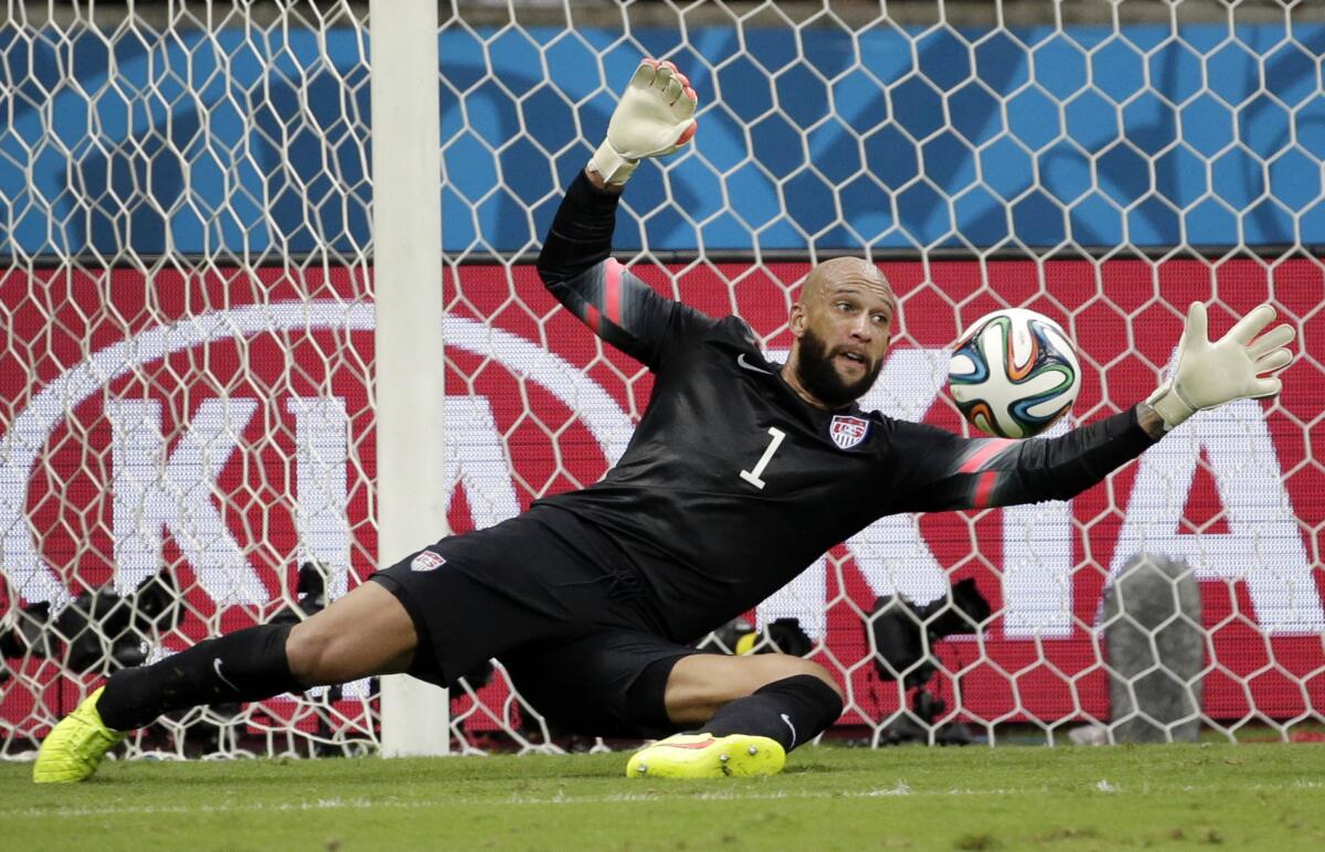 U.S. goalkeeper Tim Howard saves a shot by Belgium during the World Cup round of 16 on July 1.