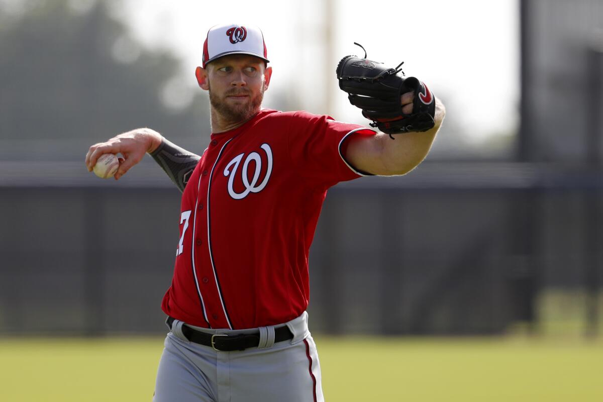 Nationals pitcher Stephen Strasburg warms up during practice on Feb. 14, 2020, in West Palm Beach, Fla.