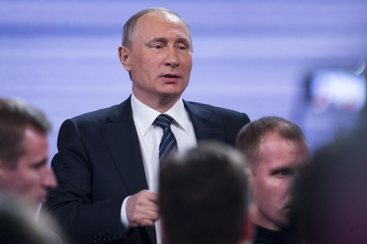 Russian President Vladimir Putin speaks Thursday at a news conference in Moscow.