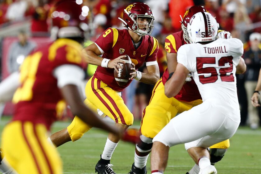 LOS ANGELES, CALIF. - SEP. 7, 2019. USC quarterback Kedon Slovis looks foir an open receiver downfield against Stanford in the first quarter at the L.A. Memorial Coliseum on Saturday night, Sep. 7, 2019. (Luis Sinco/Los Angeles Times)