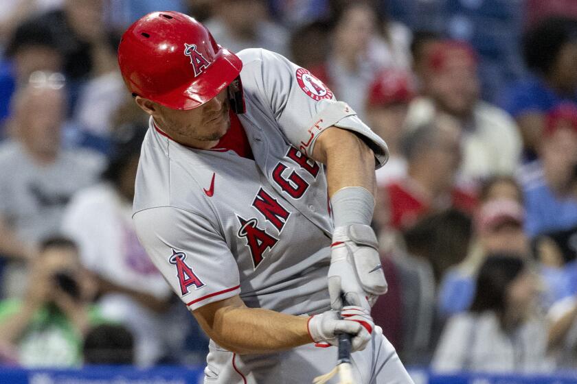 The Angels' Mike Trout breaks his bat while grounding into a fielder's choice out in the third inning June 4, 2022.
