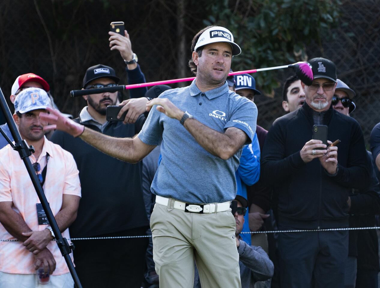 Bubba Watson lets go of his club after missing the fairway on the 11th hole during the second round of the Genesis Invitational at Riviera Country Club on Feb. 14, 2020.