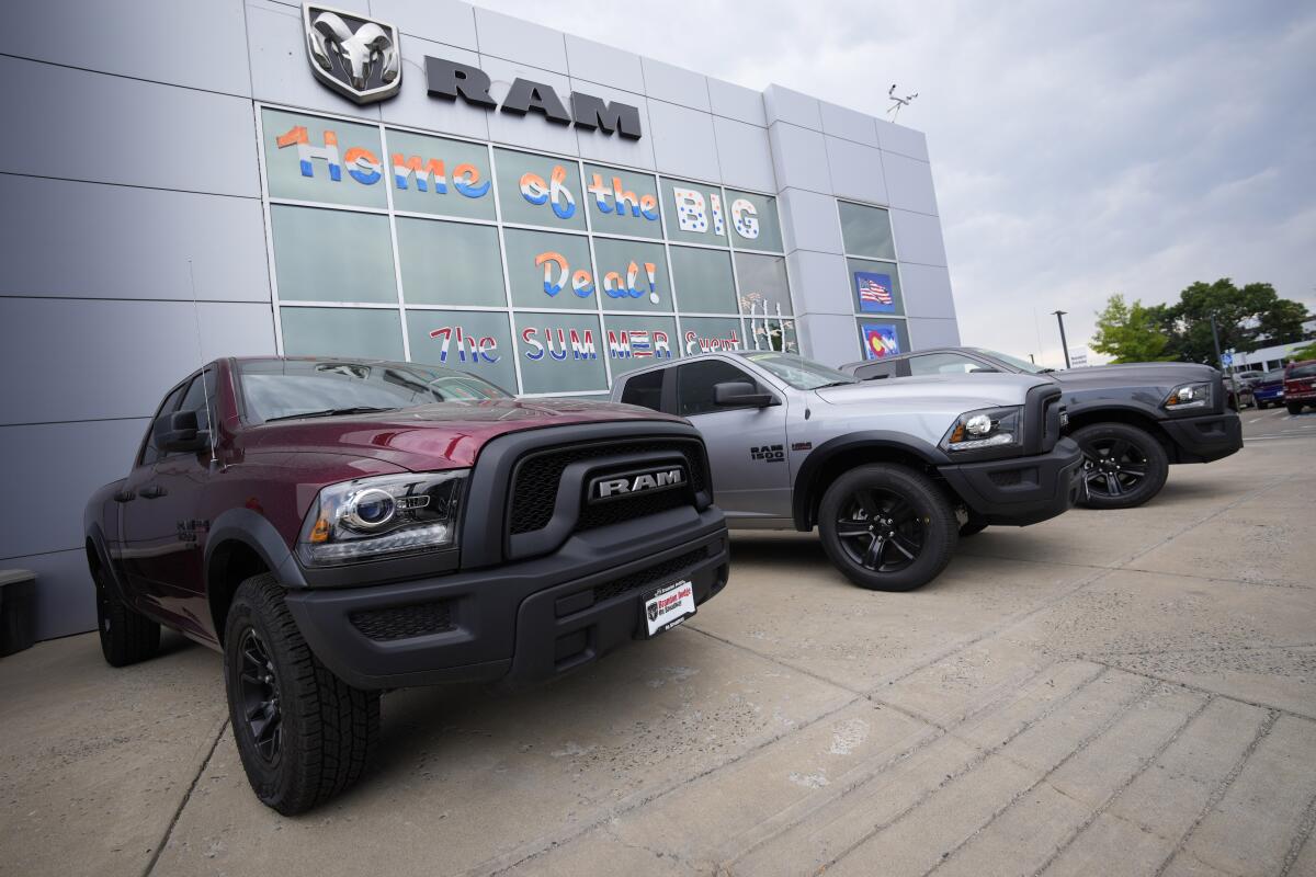 Unsold 2021 Ram pickup trucks are parked on the storage lot outside a Ram dealership on Sunday, Aug. 29, 2021, in Littleton, Colo. Growth in U.S. manufacturing accelerated in August despite the fact that companies were still struggling with supply chain problems. The Institute for Supply Management, a trade group of purchasing managers, said Wednesday that its index of manufacturing activity rose 0.4 percentage point in August to 59.9. (AP Photo/David Zalubowski)