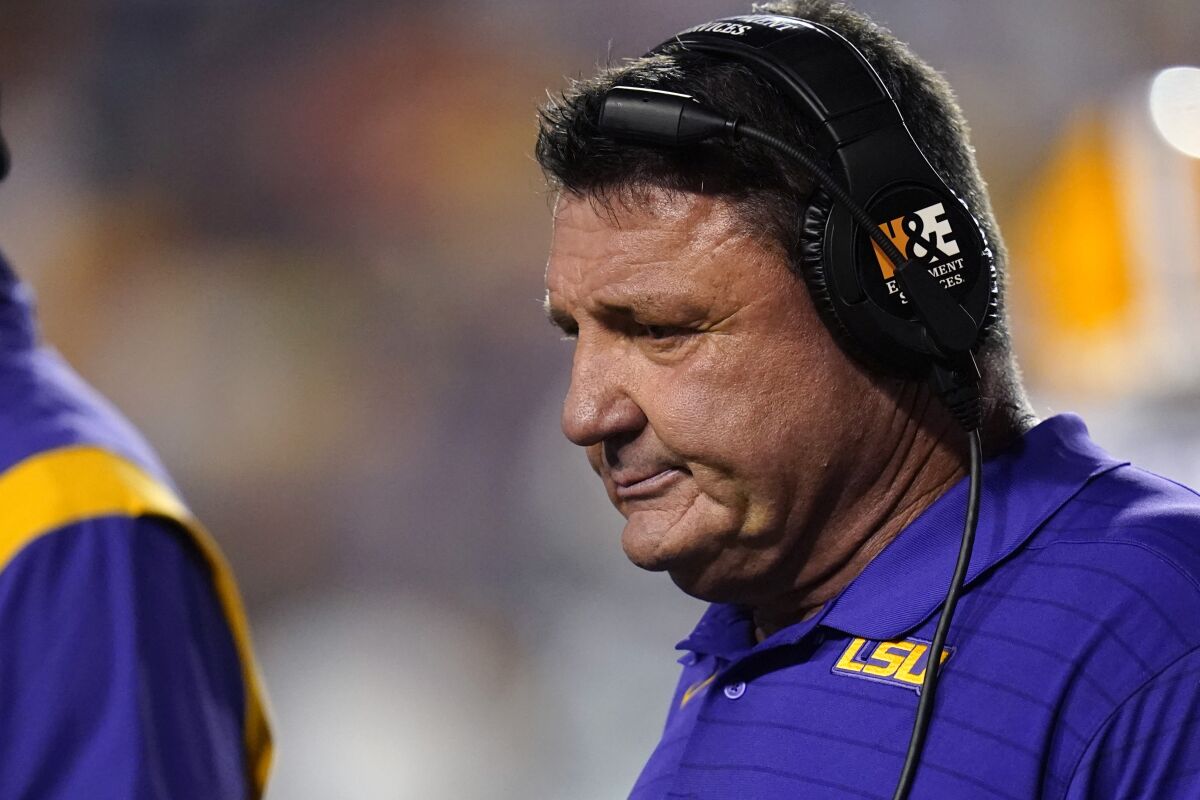 LSU coach Ed Orgeron walks on the sideline during a timeout against Auburn on Saturday.