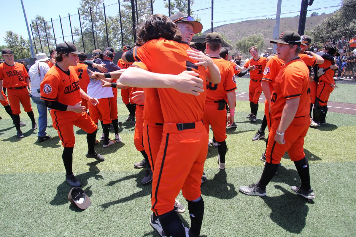 Huntington Beach players celebrate winning the CIF Southern California Regional Division I baseball final on Saturday.