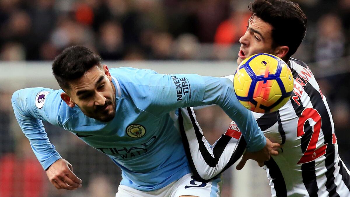 Manchester City midfielder Ilkay Gundogan battles Newcastle United midfielder Mikel Merino for the ball during a Premier League game at St James' Park on Dec 27,