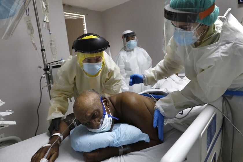 Medical students assist a COVID-19 patient at a Houston hospital.