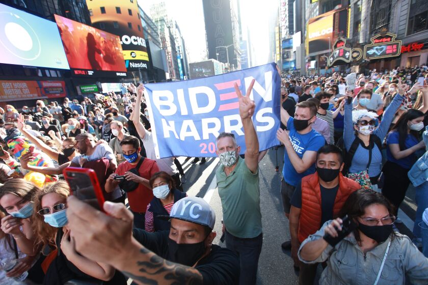 New York, New York-Nov. 7, 2020- Thousand show up for a part in the streets at Times Square to celebrate President-elect Joe Biden and Vice President Kamala Harris in Times Square New York, New York, on Nov. 7, 2020. (Kirk McKoy / Los Angeles Times)