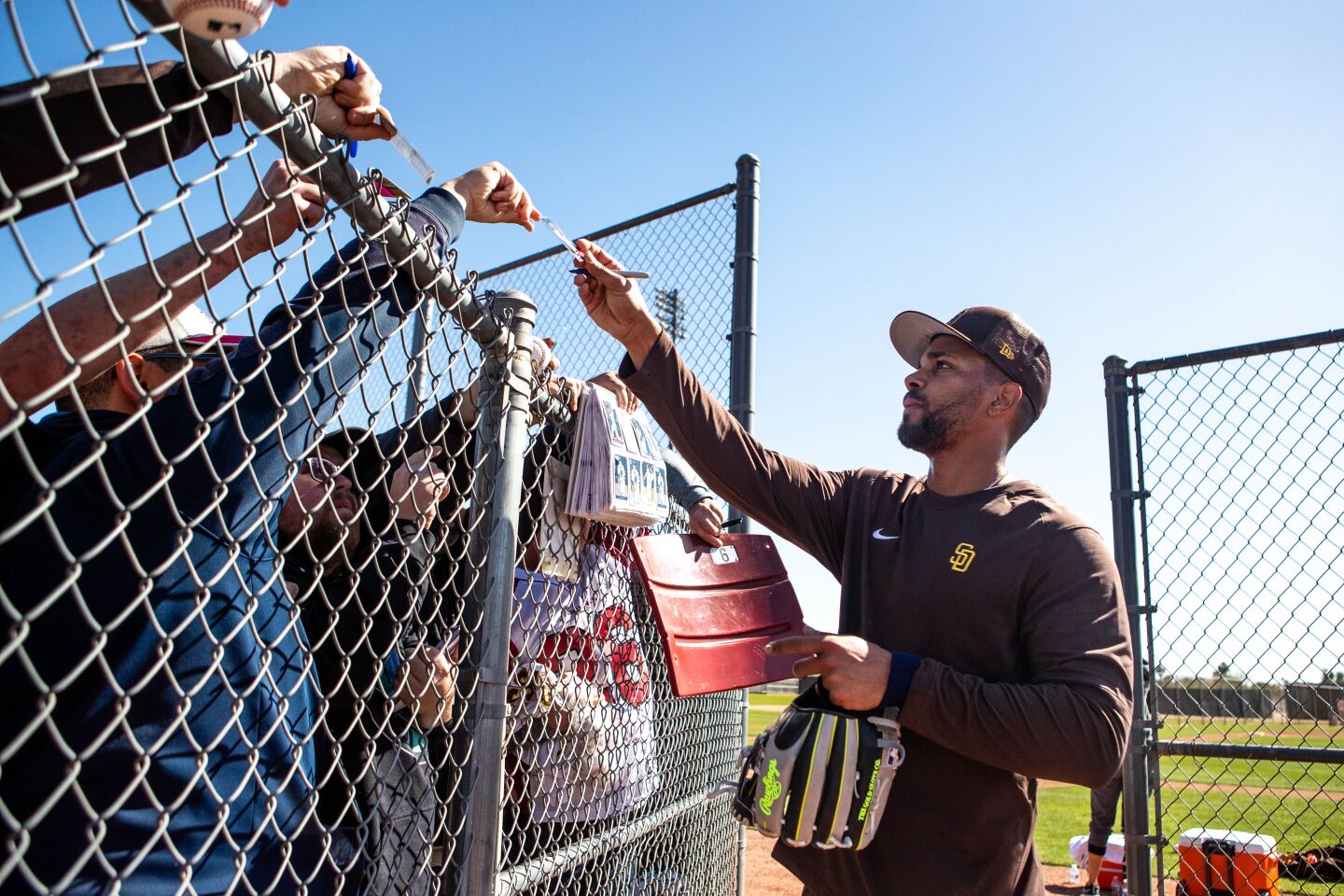 Padres shortstop Xander Bogaerts signs autographs for fans during a spring training practice at Peoria Sports Complex on Thursday.