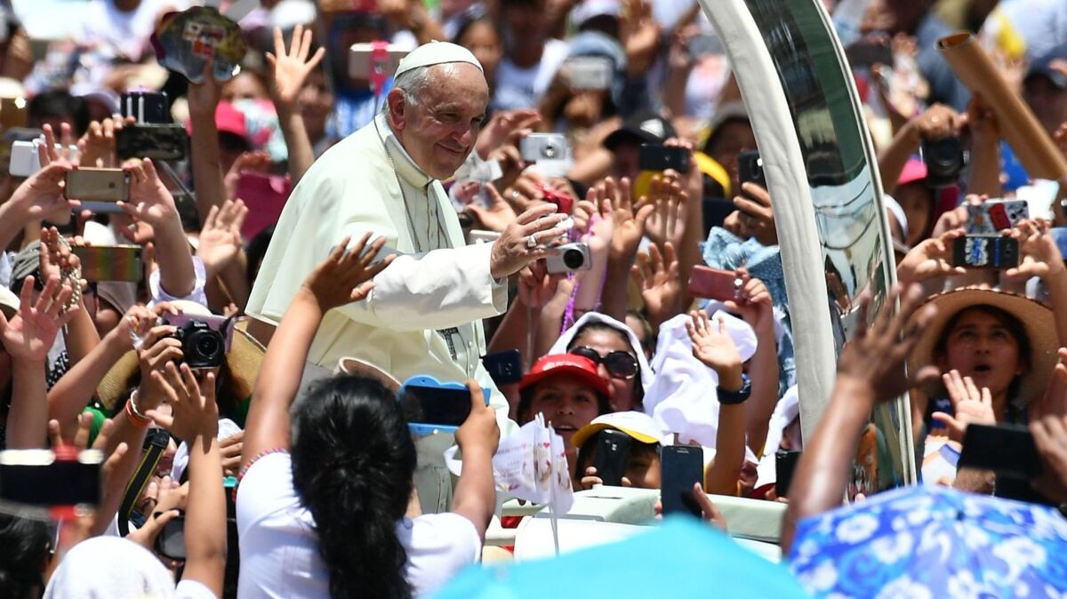 Pope Francis arrives on the popemobile Jan. 19 for a meeting with thousands of faithfuls in the Peruvian city of Puerto Maldonado.