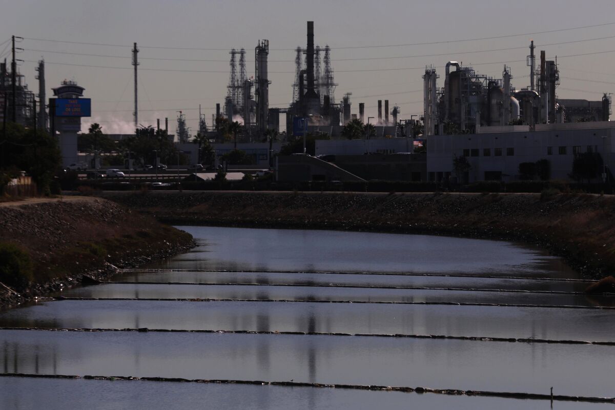 A waterway leads to a refinery.