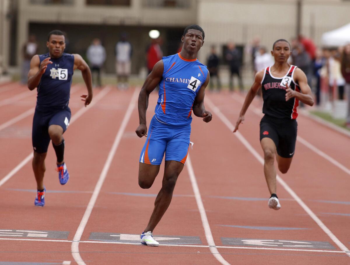 Chaminade's T.J. Brock, center, wins the boys' 100-meter dash at the Mission League track finals held at Occidental College on Thursday