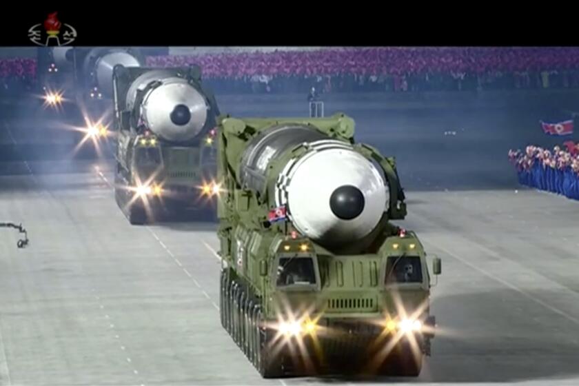 This image made from video broadcasted by North Korea's KRT, shows a military parade with what appears to be a possible new solid-fuel missile at the Kim Il Sung Square in Pyongyang, Saturday, Oct. 10, 2020. North Korean leader Kim Jong Un warned Saturday that his country would “fully mobilize” its nuclear force if threatened as he took center stage at a massive military parade to mark the 75th anniversary of the country’s ruling party. (KRT via AP)