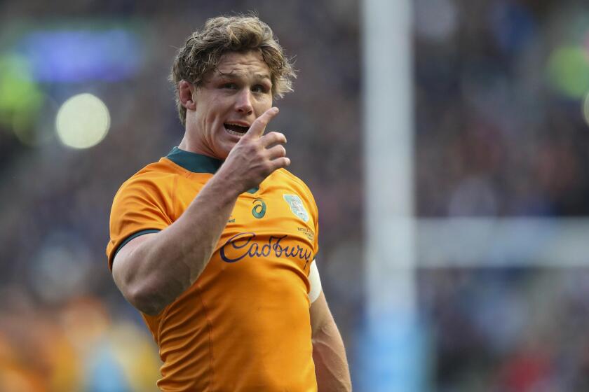 FILE- Australia's Wallaby captain Michael Hooper gestures during the rugby union international match between Scotland and Australia at the Murrayfield Stadium in Edinburgh, Scotland, Sunday, Nov. 7, 2021. After setting records in the traditional game, ex-Wallabies captain Hooper is ready to complete the transition to rugby sevens in a bid to play for Australia at the Paris Olympics.(AP Photo/Scott Heppell, File)