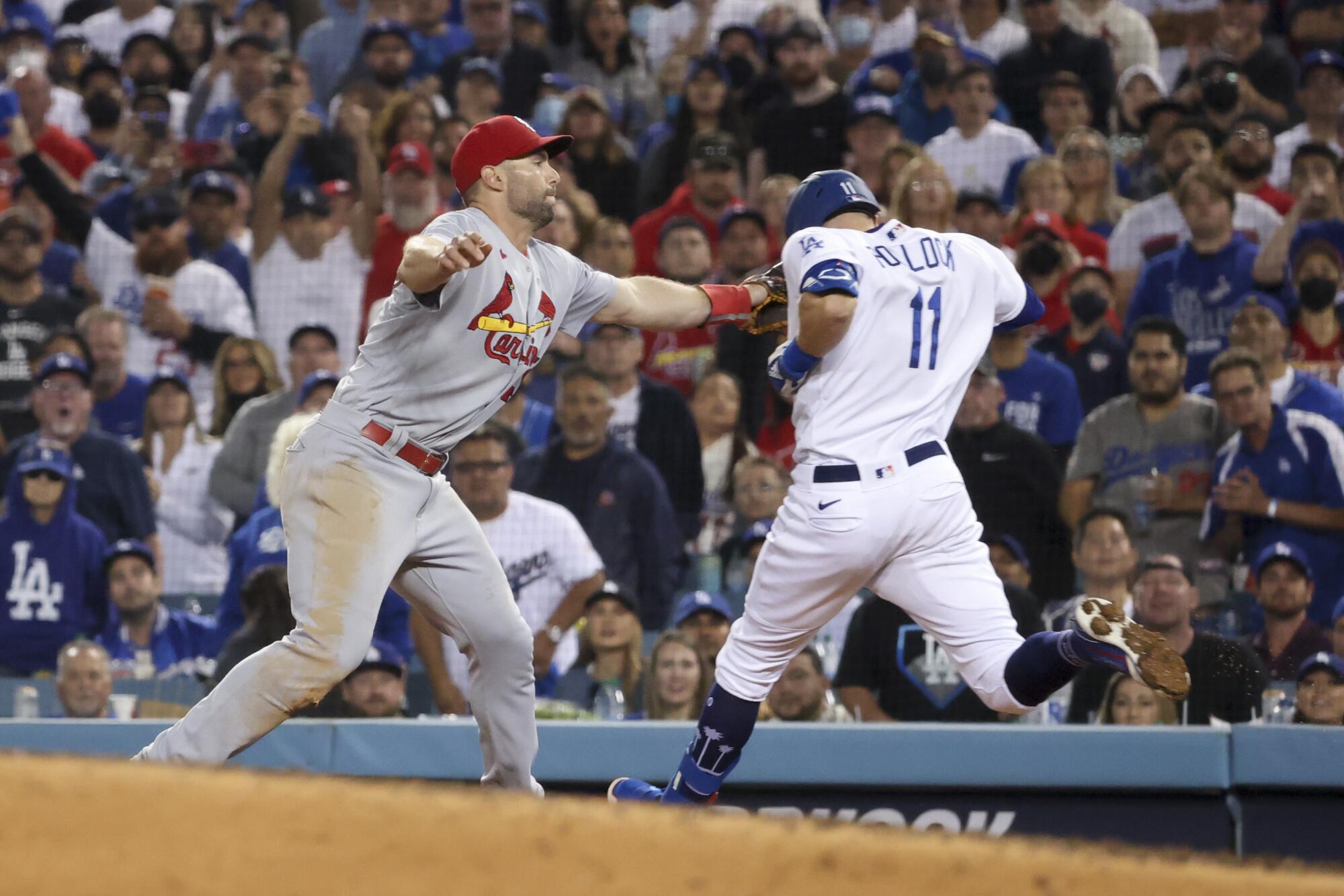 St. Louis Cardinals first baseman Paul Goldschmidt tags out Los Angeles Dodgers' AJ Pollock at first base