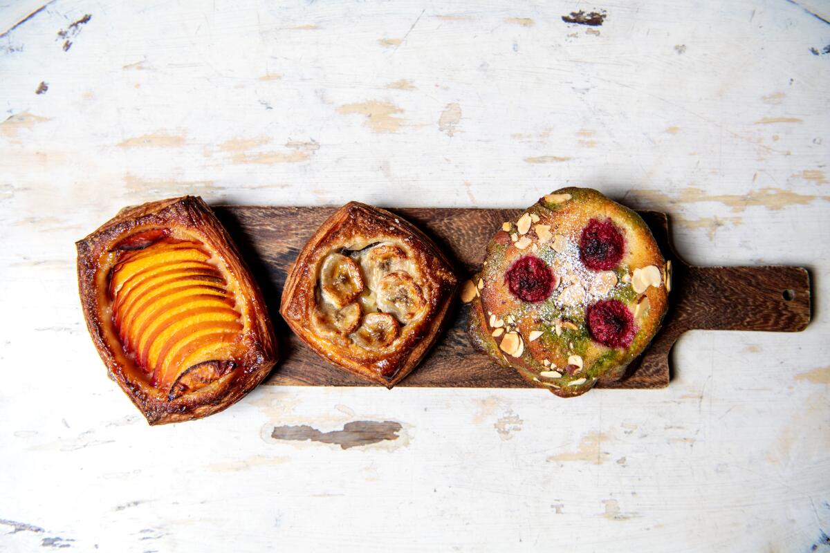 Peach danish, banana Nutella crostata and matcha raspberry bostock from the morning pastry case.